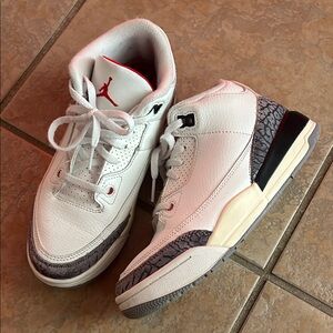 Jordan’s White and Gray Sneakers with Red Accents